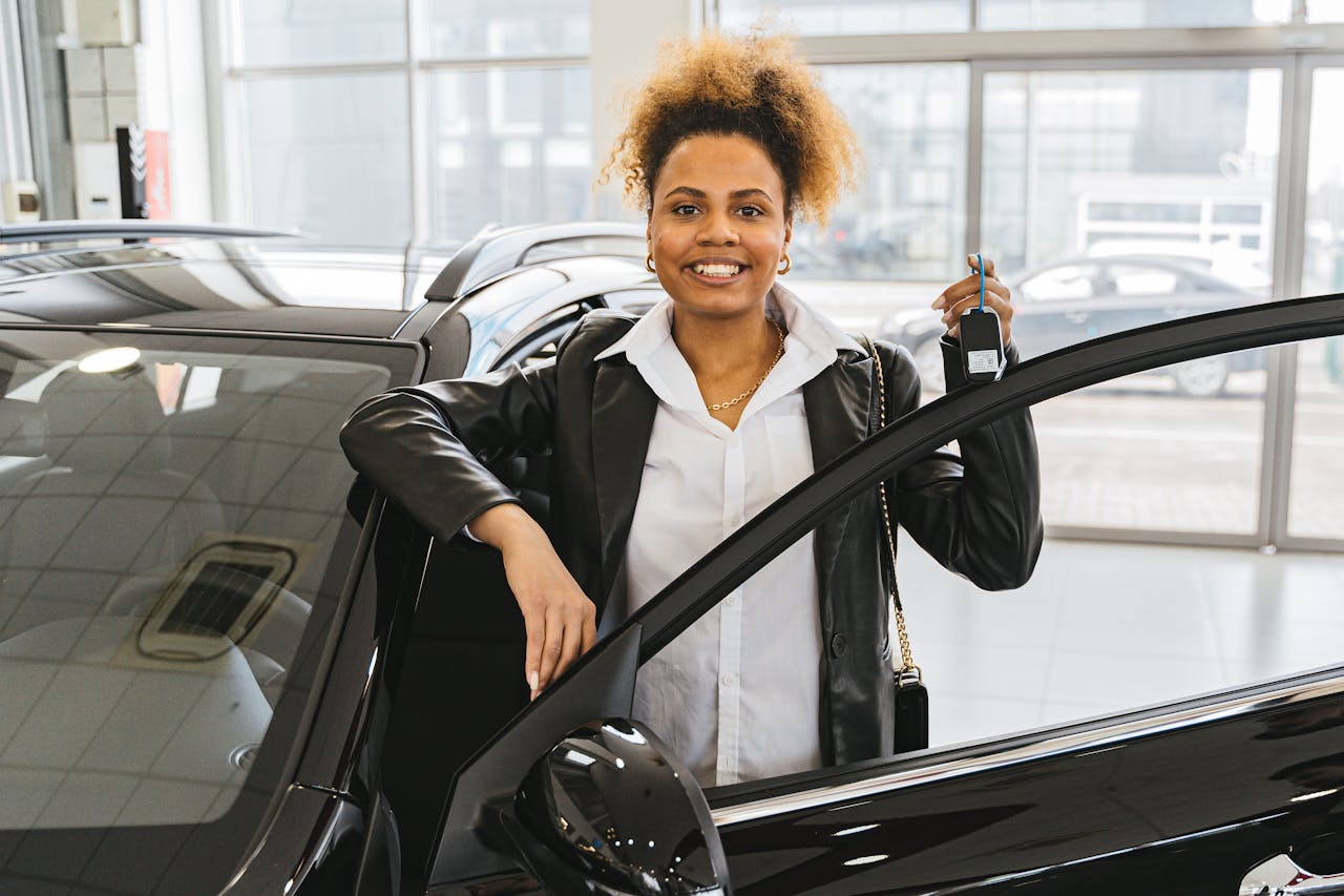 New or used cars for sale in Kenya. Woman holding car keys